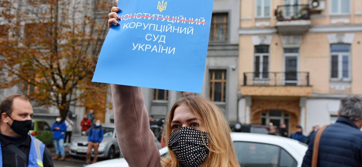 October 30, 2020, Kiev, Ukraine: A protester wearing a face mask holds a placard expressing her opinion outside the Cons