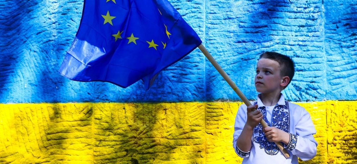 Ukrainian Kids Celebrate International Children s Day In Krakow, Poland An Ukrainian kid is holding EU flag while celebr